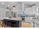 Modern kitchen featuring a large center island with bar seating, stainless steel appliances, and sleek countertops at 3324 Flamingo Ave, Charlotte, NC 28205