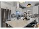 Bright kitchen with stainless steel appliances, quartz countertops, and a stylish center island with seating at 3324 Flamingo Ave, Charlotte, NC 28205