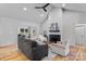 Bright living room with a vaulted ceiling, fireplace, and comfortable seating in an open layout at 3324 Flamingo Ave, Charlotte, NC 28205