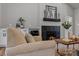 Warm and inviting living room showcasing a cozy fireplace, a mini bar, and refined decor at 3324 Flamingo Ave, Charlotte, NC 28205