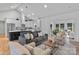 Open-concept living area with a modern kitchen, fireplace, and seamless flow, ideal for entertaining at 3324 Flamingo Ave, Charlotte, NC 28205