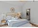 Serene bedroom with neutral tones, hardwood flooring, and access to the en-suite bathroom at 3328 Flamingo Ave, Charlotte, NC 28205