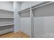 Walk-in closet with built-in shelving and ample storage space, offering functionality and organization at 3328 Flamingo Ave, Charlotte, NC 28205