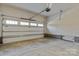 Spacious garage interior featuring a large door and concrete flooring at 3328 Flamingo Ave, Charlotte, NC 28205