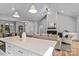 Open-concept kitchen and living space with a seamless flow, featuring modern finishes and ample natural light at 3328 Flamingo Ave, Charlotte, NC 28205