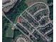 Aerial view of a residential community featuring tree-lined streets and well-maintained homes near Twelve Mile Creek Greenway at 3500 Exbury Gardens Dr, Waxhaw, NC 28173