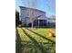 Expansive backyard with a screened porch and mature trees providing shade at 3500 Exbury Gardens Dr, Waxhaw, NC 28173