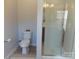 Bathroom with toilet, glass-enclosed shower, and neutral finishes at 3500 Exbury Gardens Dr, Waxhaw, NC 28173