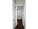 Compact powder room features hardwood floors, decorative wall art, and a toilet with modern accessories at 3500 Exbury Gardens Dr, Waxhaw, NC 28173