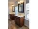 Bathroom boasts double vanities, framed mirrors, and natural light from two windows at 3500 Exbury Gardens Dr, Waxhaw, NC 28173