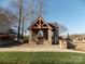 Charming stone gazebo in the Prescott community, with a peaked roof and open archways at 3500 Exbury Gardens Dr, Waxhaw, NC 28173