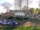An attractive stone sign marking the Prescott community, adorned with flowers and shrubbery at 3500 Exbury Gardens Dr, Waxhaw, NC 28173