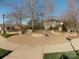 A lush community space offers beautiful hardscapes and landscaping on a clear day at 3500 Exbury Gardens Dr, Waxhaw, NC 28173