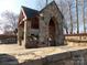 Stone community structure in landscaped green space offers a venue to gather at 3500 Exbury Gardens Dr, Waxhaw, NC 28173