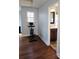 Exercise room features wood floors and a window for natural light, adjacent to a bathroom at 3500 Exbury Gardens Dr, Waxhaw, NC 28173
