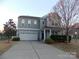 Charming two-story home features a two-car garage and well-manicured landscaping in a desirable neighborhood at 3500 Exbury Gardens Dr, Waxhaw, NC 28173