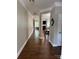 Inviting home hallway featuring elegant trim detail and hardwood flooring, transitioning into the main living area at 3500 Exbury Gardens Dr, Waxhaw, NC 28173