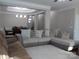 Bright living room with a neutral palette, a dining table, and a large comfortable sectional sofa at 3500 Exbury Gardens Dr, Waxhaw, NC 28173
