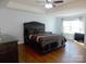 Spacious main bedroom with a tray ceiling, ceiling fan, and natural light from a window at 3500 Exbury Gardens Dr, Waxhaw, NC 28173