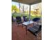 Relaxing screened porch furnished with chairs and glass table overlooking the backyard at 3500 Exbury Gardens Dr, Waxhaw, NC 28173