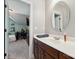 Bathroom features an oval mirror above the vanity and modern fixtures at 369 Shoreline Pkwy, Tega Cay, SC 29708