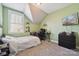 Cozy bedroom with green walls and a dedicated gaming and study area at 369 Shoreline Pkwy, Tega Cay, SC 29708