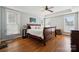 Spacious primary bedroom with tray ceilings, hardwood floors, and lots of natural light at 369 Shoreline Pkwy, Tega Cay, SC 29708