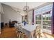 Bright dining room with hardwood floors leads to a spacious deck, perfect for entertaining at 369 Shoreline Pkwy, Tega Cay, SC 29708
