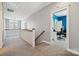 Hallway with carpeted floors, staircase, and a view of the second bedroom at 369 Shoreline Pkwy, Tega Cay, SC 29708