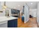 Modern kitchen featuring blue cabinets, stainless steel appliances and light countertops at 369 Shoreline Pkwy, Tega Cay, SC 29708