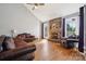 Inviting living room features a stone fireplace, hardwood floors, and plenty of natural light at 369 Shoreline Pkwy, Tega Cay, SC 29708