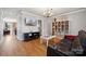Comfortable living room featuring hardwood floors and modern entertainment setup at 369 Shoreline Pkwy, Tega Cay, SC 29708