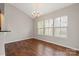 Dining room with large windows, hardwood floors and a chandelier at 4095 Harmattan Dr, Denver, NC 28037
