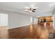 Spacious living room features wood flooring and neutral paint, offering great flow to the kitchen at 4095 Harmattan Dr, Denver, NC 28037
