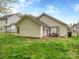 Spacious backyard with green grass, a privacy fence, and a patio area for outdoor enjoyment at 4677 Arthur Way, Rock Hill, SC 29732