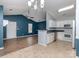 Bright kitchen featuring white cabinetry, modern appliances, and an open design to the living area at 4677 Arthur Way, Rock Hill, SC 29732