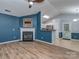 Cozy living room with fireplace adjacent to kitchen, perfect for entertaining at 4677 Arthur Way, Rock Hill, SC 29732