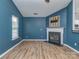 Inviting living room with a cozy fireplace and modern wood flooring at 4677 Arthur Way, Rock Hill, SC 29732