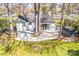 Aerial view of private backyard featuring trees and patio at 5009 Milford Rd, Charlotte, NC 28210