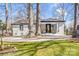 Charming brick home with well-maintained backyard and stone patio, perfect for outdoor living at 5009 Milford Rd, Charlotte, NC 28210