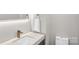 Stylish powder room featuring a modern sink, marble countertop, and a sleek mirror at 5009 Milford Rd, Charlotte, NC 28210