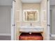Beautiful bathroom featuring a modern, illuminated mirror and floating marble vanity at 5009 Milford Rd, Charlotte, NC 28210