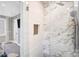 Luxury bathroom with glass enclosed shower, marble surround, and shower controls at 5009 Milford Rd, Charlotte, NC 28210