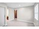 Bedroom featuring closet, window, trim, and an ensuite bathroom at 5009 Milford Rd, Charlotte, NC 28210