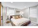 Cozy bedroom with a large bed, soft lighting, and barn door access at 5009 Milford Rd, Charlotte, NC 28210