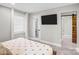 Bedroom with a TV, window and walk in closet at 5009 Milford Rd, Charlotte, NC 28210