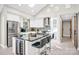 Bright kitchen features a black marble island, stainless steel appliances, and skylight at 5009 Milford Rd, Charlotte, NC 28210