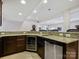 Finished basement bar with seating, granite countertops, and bar fridge at 5059 Saint Clair St, Fort Mill, SC 29715