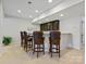 Finished basement bar with seating, granite countertops, and custom cabinets at 5059 Saint Clair St, Fort Mill, SC 29715