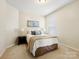 Calm bedroom with a comfortable bed, neutral tones, and soft lighting, creating a serene atmosphere at 5059 Saint Clair St, Fort Mill, SC 29715